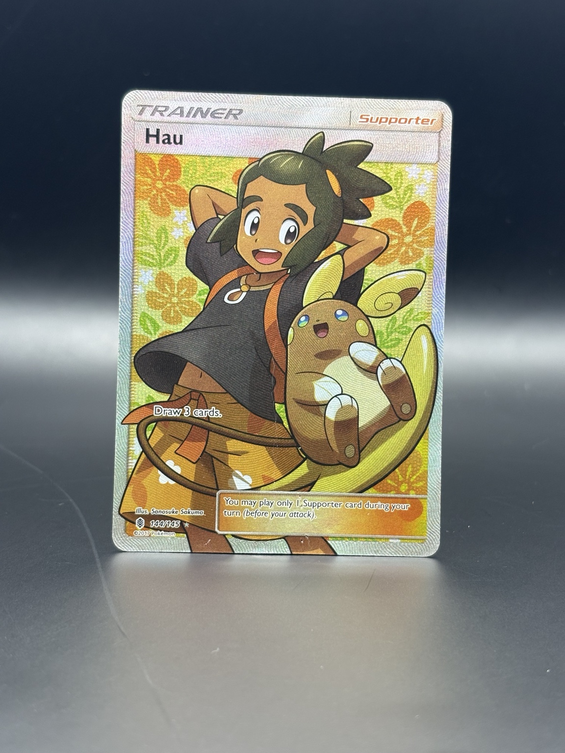 Hau full-art card after restoration