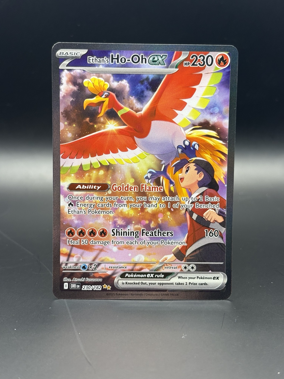Second view of Ethan's Ho-Oh ex card before restoration